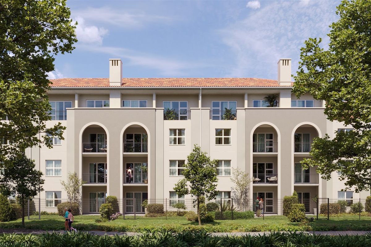 A professional architectural rendering of a modern apartment building facade featuring arched balconies, tiled roofing, and landscaped garden surroundings.