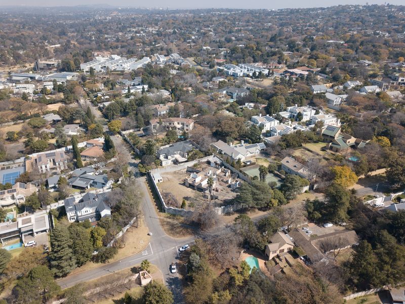 An aerial view of a residential neighborhood showcasing the property location, surrounding street layout, and established suburban landscape.
