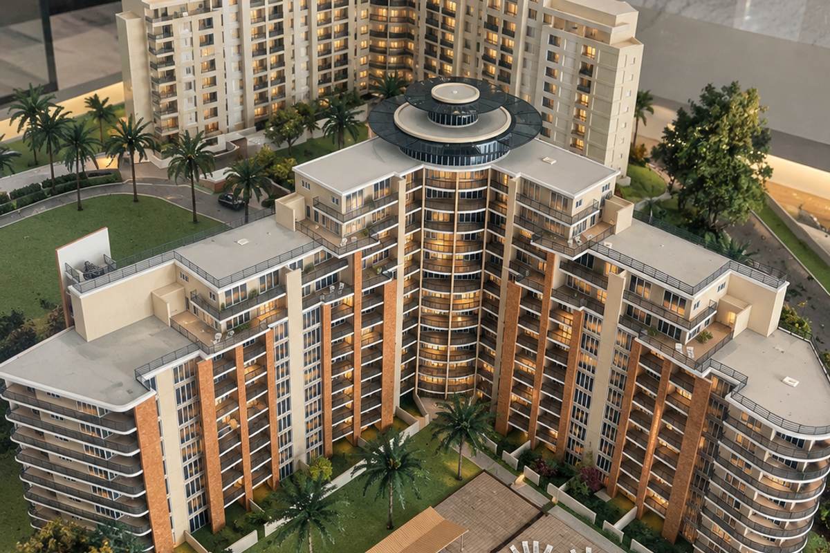 A detailed architectural scale model of a multi-story apartment complex featuring a central swimming pool, landscaped gardens, and private balconies.