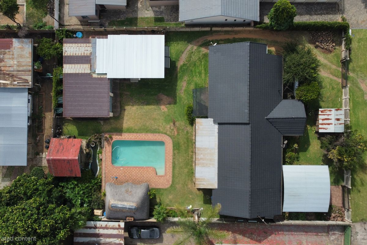 Discover a residence that masterfully balances expansive family living with high-yield investment po - Photo 2