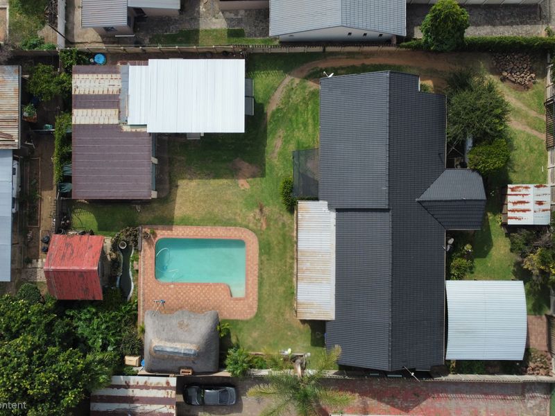 Discover a residence that masterfully balances expansive family living with high-yield investment po - Photo 2