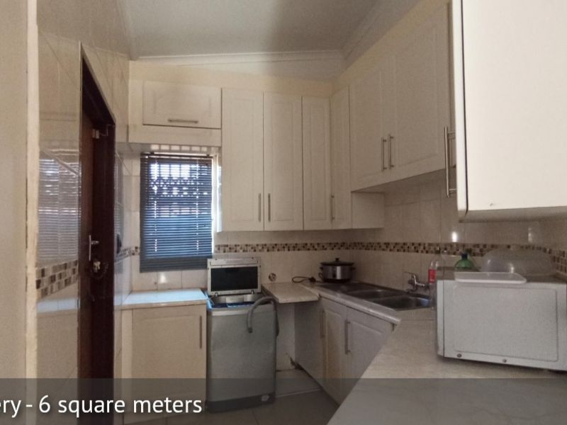 Elegant 4-Bedroom Family Home with Pool in The Orchards - Photo 9