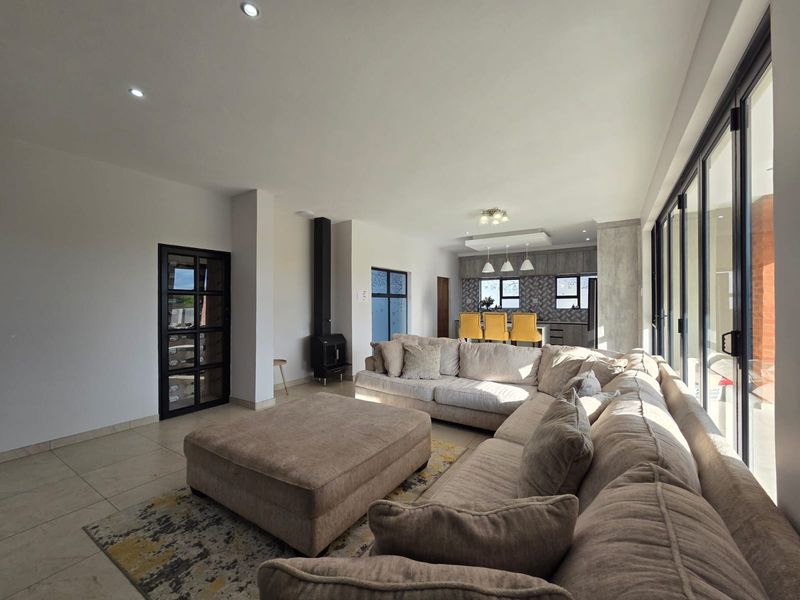 Luxury Architectural Statement Home with Panoramic Magaliesberg Views - Photo 10