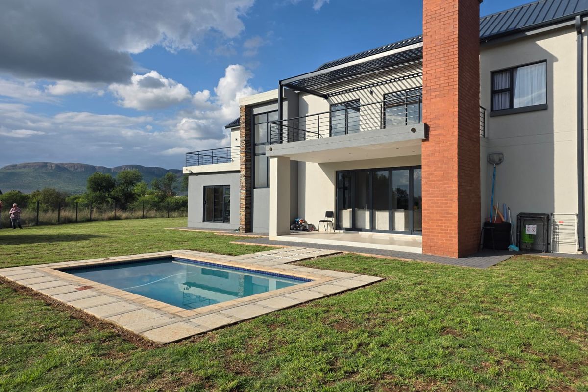 Luxury Architectural Statement Home with Panoramic Magaliesberg Views - Photo 2