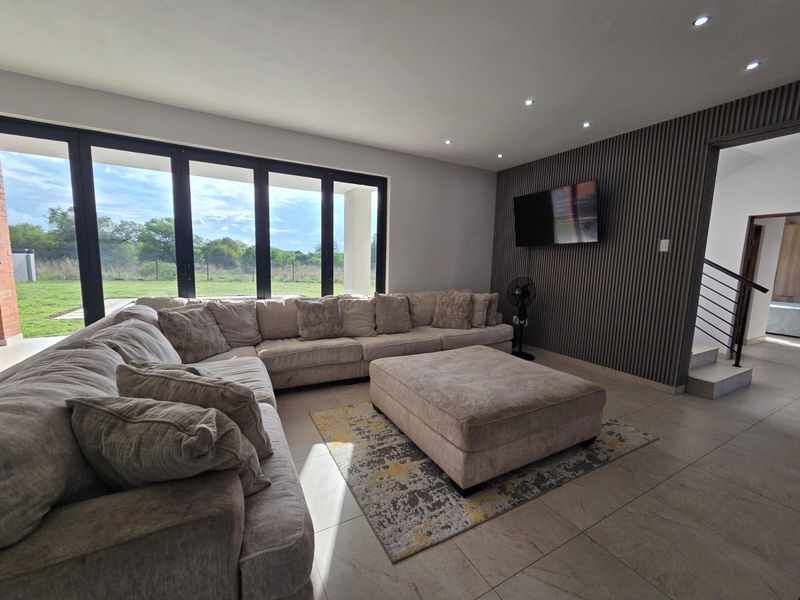 Luxury Architectural Statement Home with Panoramic Magaliesberg Views - Photo 9