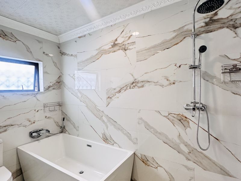 Spacious 7-Bedroom Modern Home with Style & Endless Potential - Photo 10