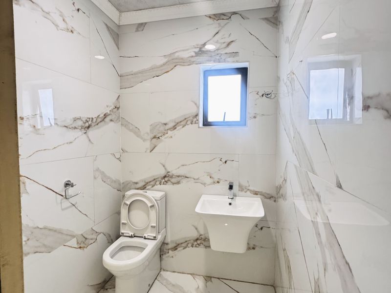 Spacious 7-Bedroom Modern Home with Style & Endless Potential - Photo 9