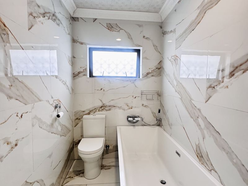 Spacious 7-Bedroom Modern Home with Style & Endless Potential - Photo 8