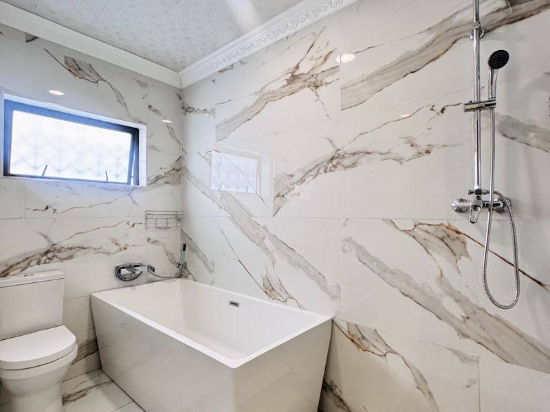 Spacious 7-Bedroom Modern Home with Style & Endless Potential - Photo 7