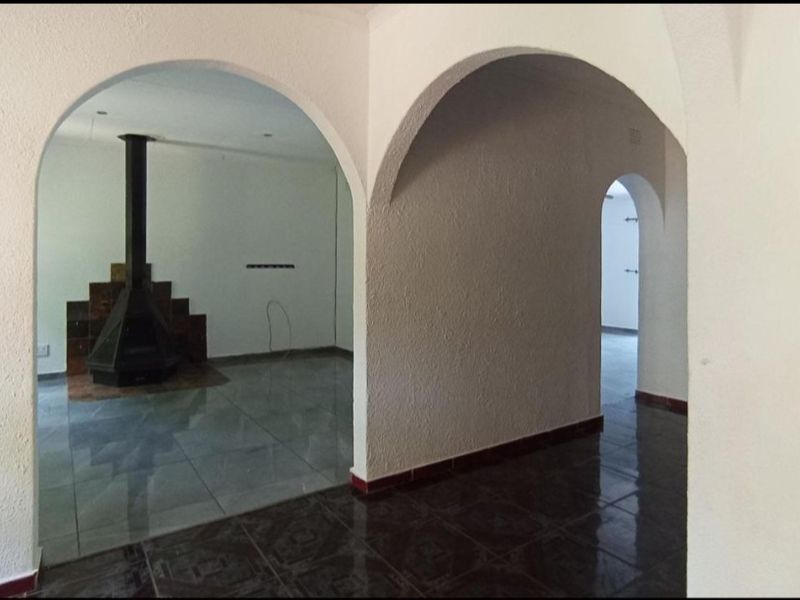 Spacious 4-Bedroom Family Home with Pool and Unique Indoor Fire Feature - Photo 8