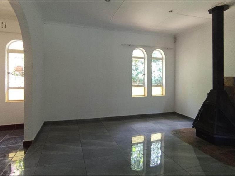 Spacious 4-Bedroom Family Home with Pool and Unique Indoor Fire Feature - Photo 9