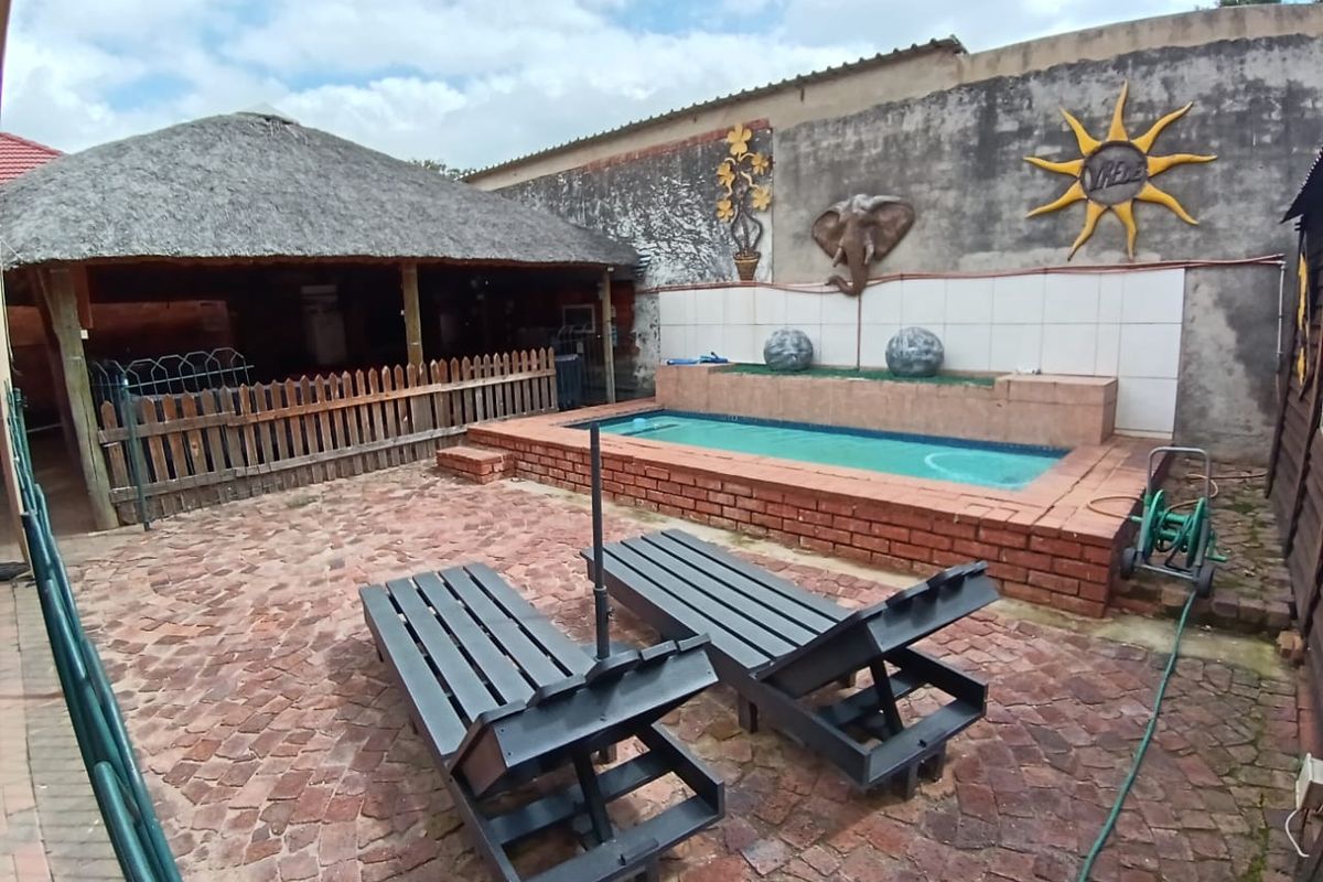 Stunning 4- Bedroom Home with Modern Finishes & Income -Generating - Photo 5