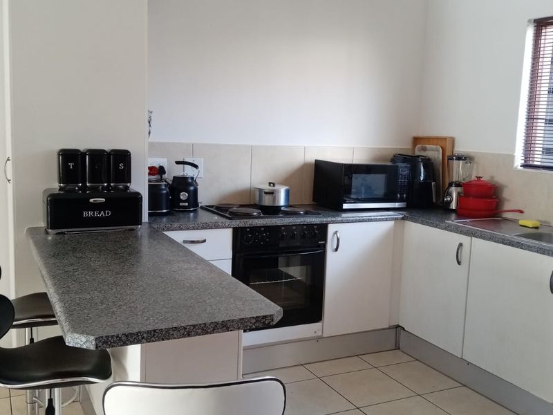 Step into comfort, convenience, and opportunity with this charming 2-bedroom townhouse. - Photo 3