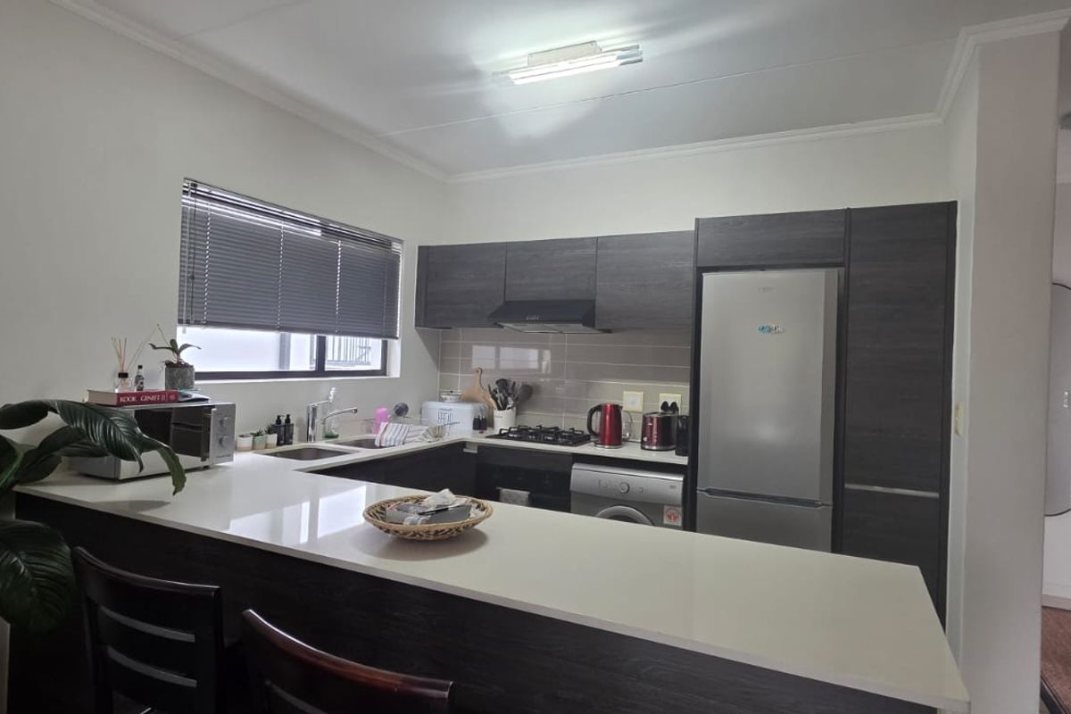 Step into modern, convenient living with this stylish first-floor apartment - Photo 4