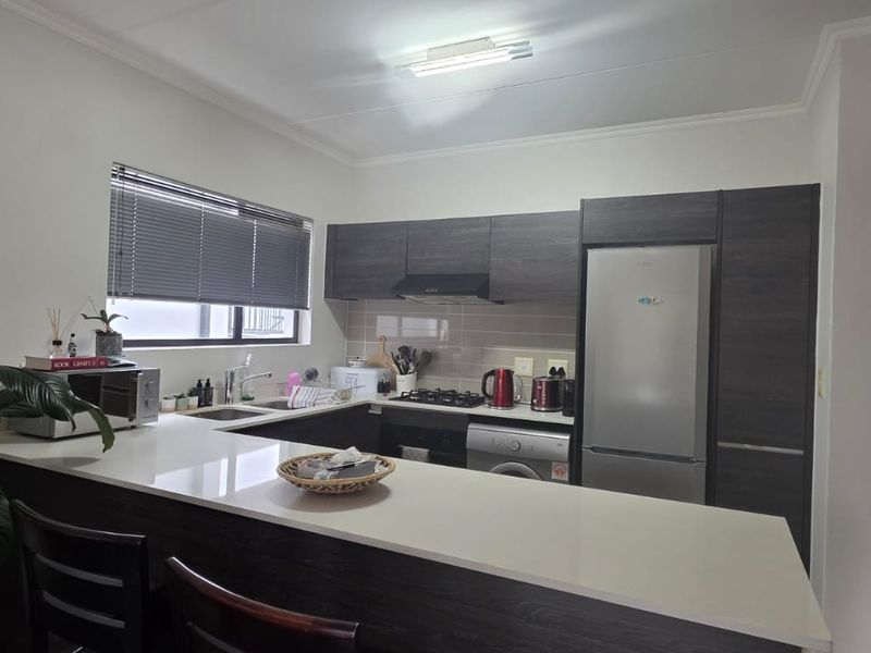 Step into modern, convenient living with this stylish first-floor apartment - Photo 4