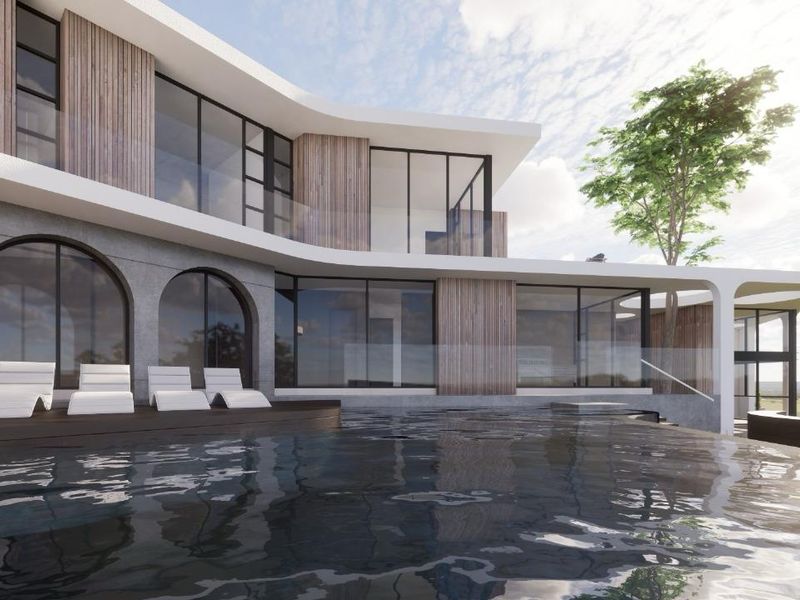A modern luxury residence featuring a sleek infinity pool, timber decking, and expansive glass facades with contemporary architectural design.