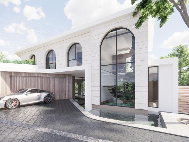 A modern architectural front elevation featuring arched windows, stone cladding, a timber garage door, and a decorative water feature.