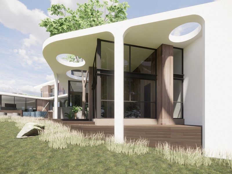 A modern architectural rendering of a rear exterior facade featuring a covered patio, timber decking, and expansive glass windows overlooking a landscaped yard.