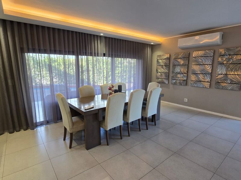 Modern Family Living with Pool & Backup Power in Palm Lakes Estate - Photo 8