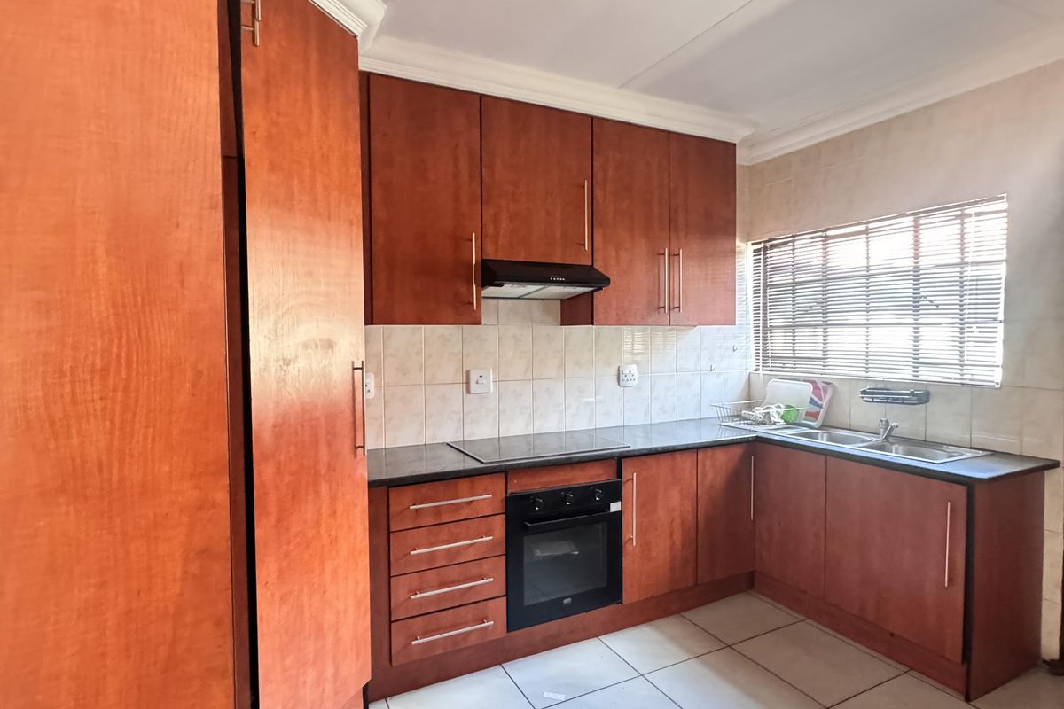 Charming 3 Bedroom Family Home with Spacious Yard and Drive-Through Garage in Ext 18 - Photo 2