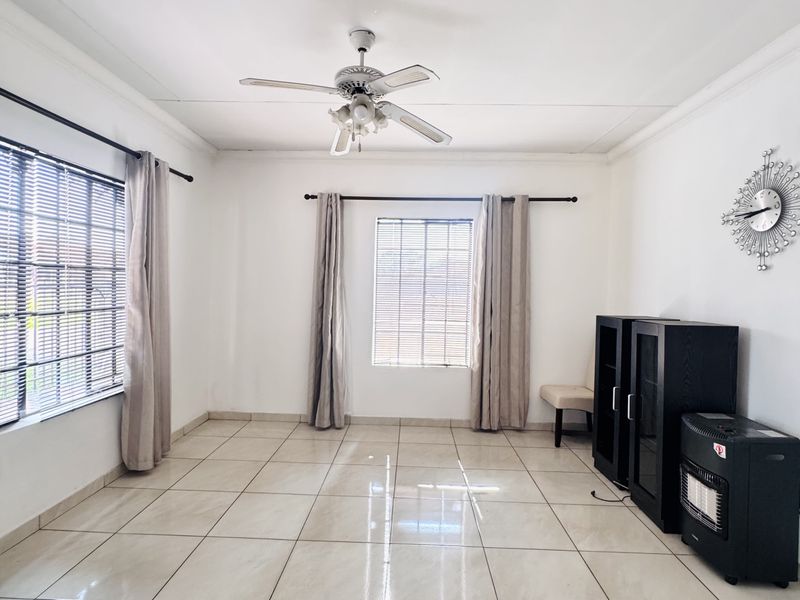 Charming 3 Bedroom Family Home with Spacious Yard and Drive-Through Garage in Ext 18 - Photo 9