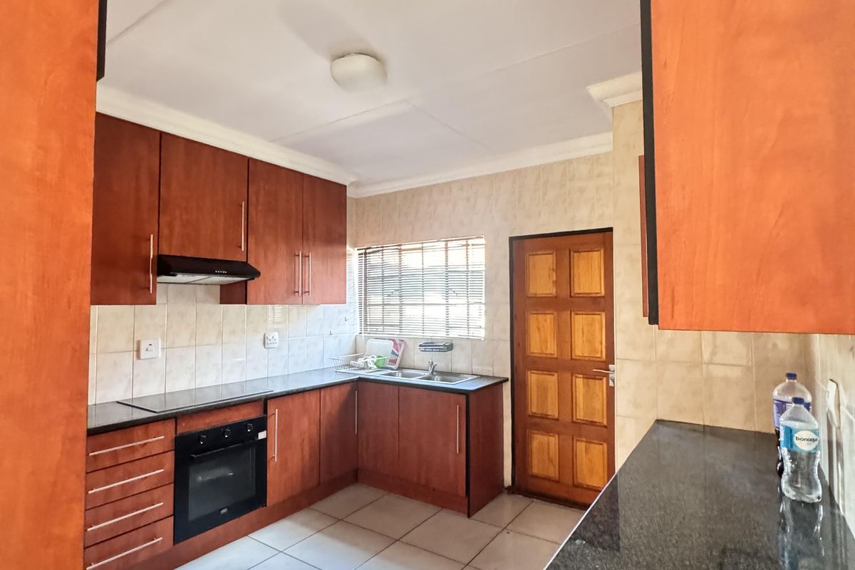 Charming 3 Bedroom Family Home with Spacious Yard and Drive-Through Garage in Ext 18 - Photo 3