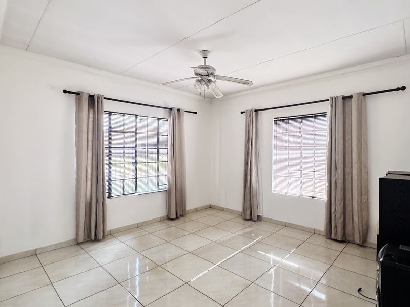 Charming 3 Bedroom Family Home with Spacious Yard and Drive-Through Garage in Ext 18 - Photo 6