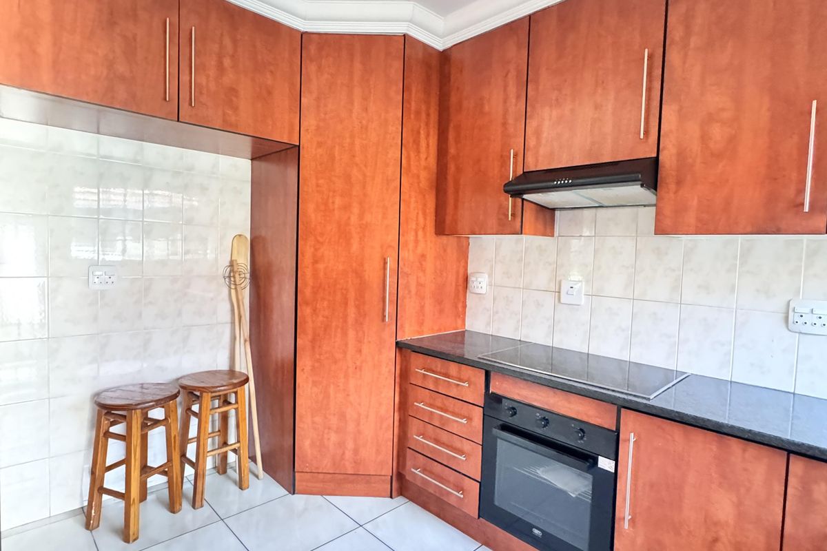 Charming 3 Bedroom Family Home with Spacious Yard and Drive-Through Garage in Ext 18 - Photo 4