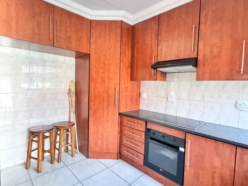 Charming 3 Bedroom Family Home with Spacious Yard and Drive-Through Garage in Ext 18 - Photo 4