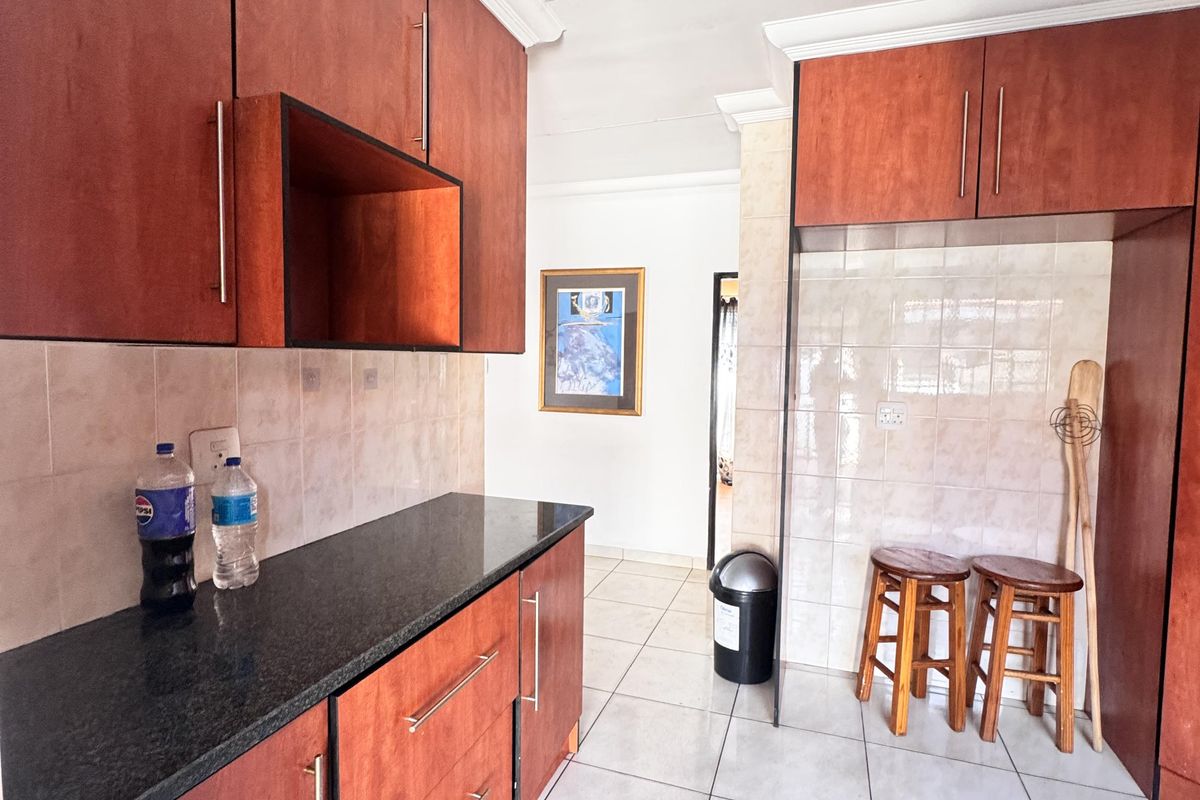 Charming 3 Bedroom Family Home with Spacious Yard and Drive-Through Garage in Ext 18 - Photo 5