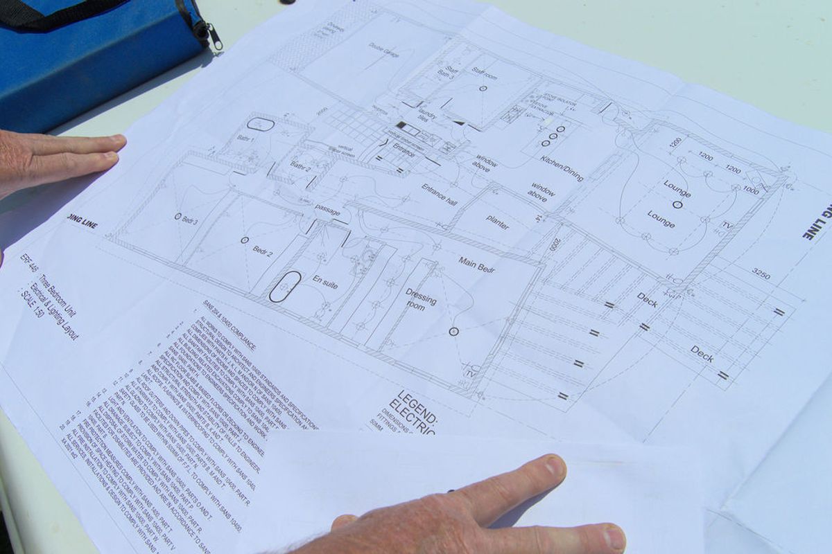 A detailed electrical and lighting layout floor plan for a three-bedroom residential unit, showing room configurations and service placements.