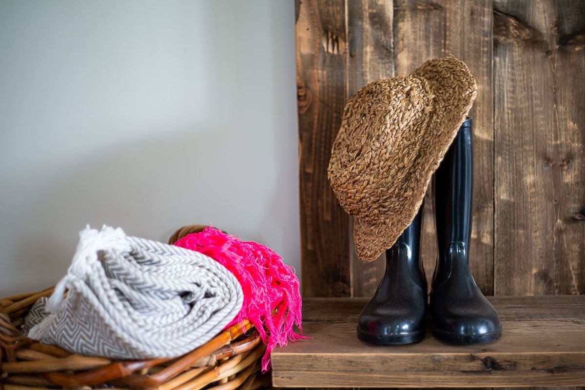A close-up view of a rustic wooden shelf and wall paneling, showcasing natural timber textures.