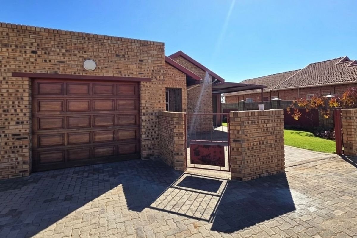 Step into comfort and convenience with this neat and modern sectional title townhouse. - Photo 2