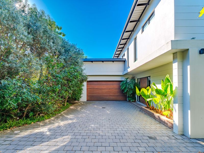 Modern Freestanding Home with Solar, Inverter & Seamless Indoor-Outdoor Living in Simbithi - Photo 1