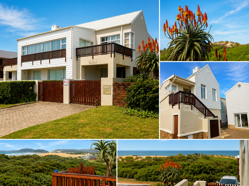 A multi-level coastal house featuring timber balconies, paved driveway, and scenic ocean views, set within a landscaped garden environment.