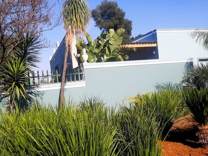 Charming 3-Bedroom Home with Guest House Potential in a Secure Estate - Photo 2