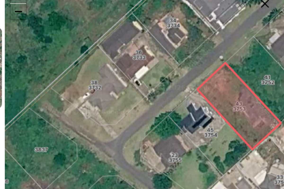 An aerial satellite view showing the residential plot boundaries and surrounding neighborhood layout.
