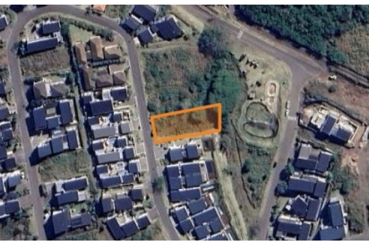 Aerial view of a vacant residential land plot situated within an established suburban neighborhood.