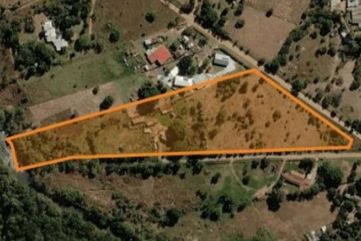 An aerial view showing the property boundaries and surrounding landscape of the farm plot.