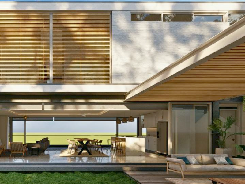 Modern open-plan living area featuring seamless indoor-outdoor flow, timber slatted ceilings, stone flooring, and a contemporary kitchen with a central island.