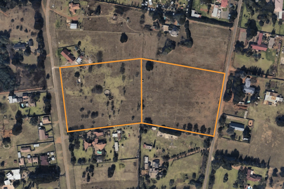 Aerial view of two adjacent vacant residential plots, highlighting the property boundaries and surrounding neighborhood landscape.