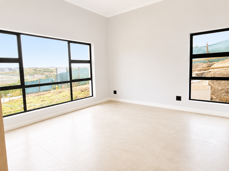 A bright, modern, and empty bedroom featuring large aluminium-framed windows, neutral tiled flooring, and clean white walls, ready for personalization.