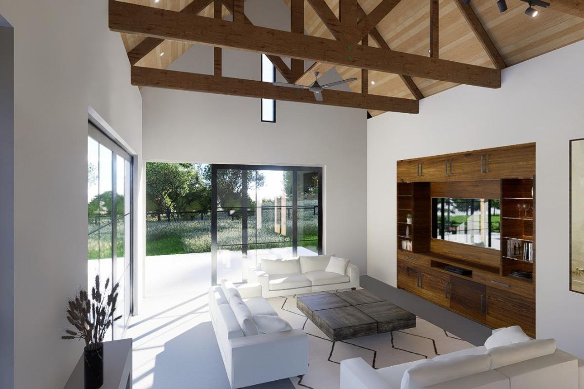 Spacious living room featuring a vaulted ceiling with exposed timber trusses, built-in media cabinetry, and large sliding glass doors opening to the garden.