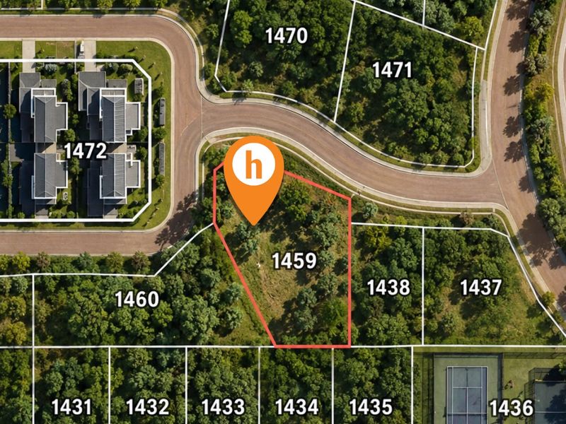 Aerial view of a vacant residential plot, identified as lot 1459, situated within a landscaped estate with surrounding vegetation and nearby tennis courts.