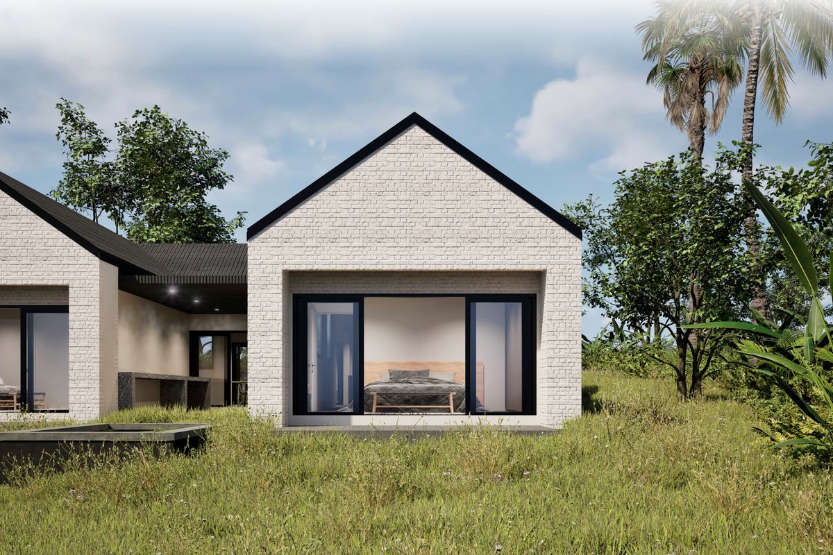 A modern single-story residence featuring white brick exterior walls, black metal roofing, and large sliding glass doors opening to a natural garden setting.