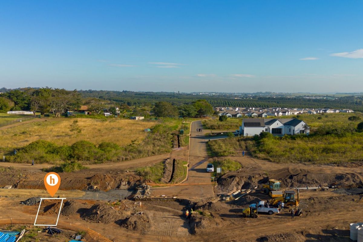 Aerial view of a residential vacant land plot under development, featuring ongoing earthworks and access to local infrastructure.