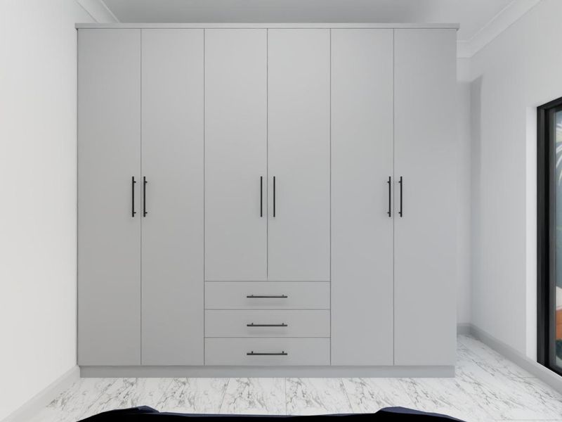 A modern bedroom featuring a large, sleek built-in wardrobe with integrated drawers, marble-look flooring, and a large window overlooking a garden.