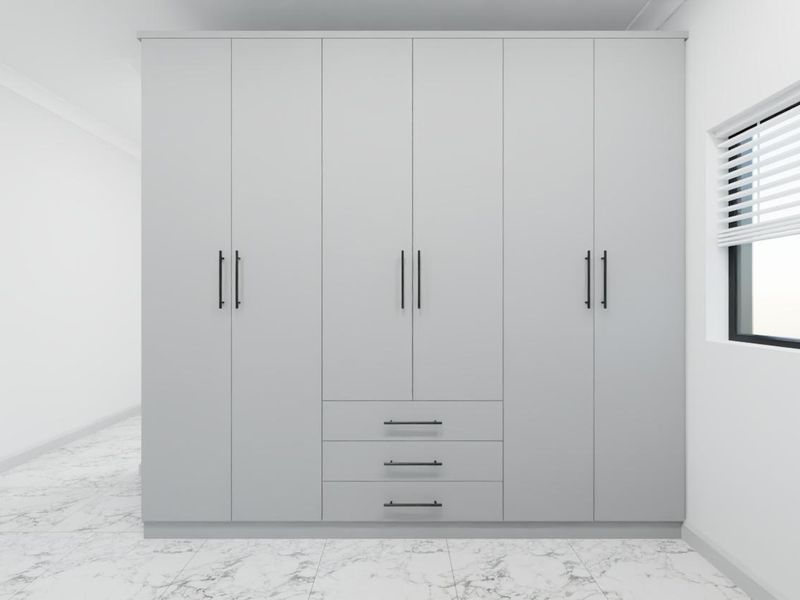 A modern bedroom featuring a large, sleek built-in wardrobe with matte grey finish, complemented by marble-look floor tiles and clean white walls.