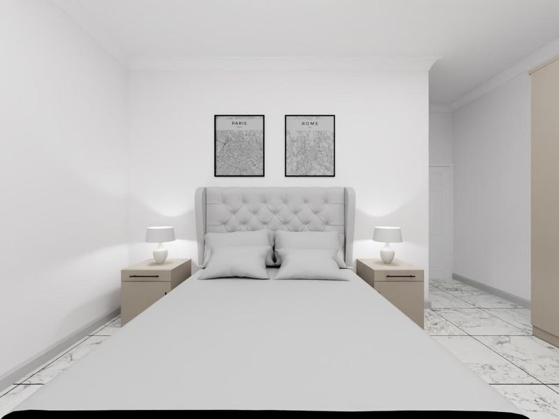 A modern, well-lit bedroom featuring neutral tones, tiled flooring, and a built-in wardrobe, offering a clean and contemporary living space.