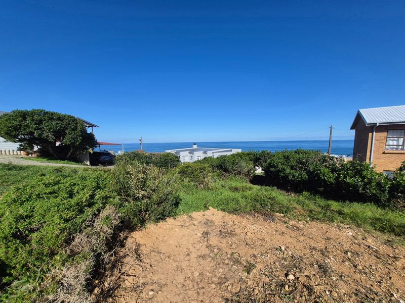 A scenic view of the ocean from the vacant residential land, showcasing the coastal landscape and surrounding neighborhood.